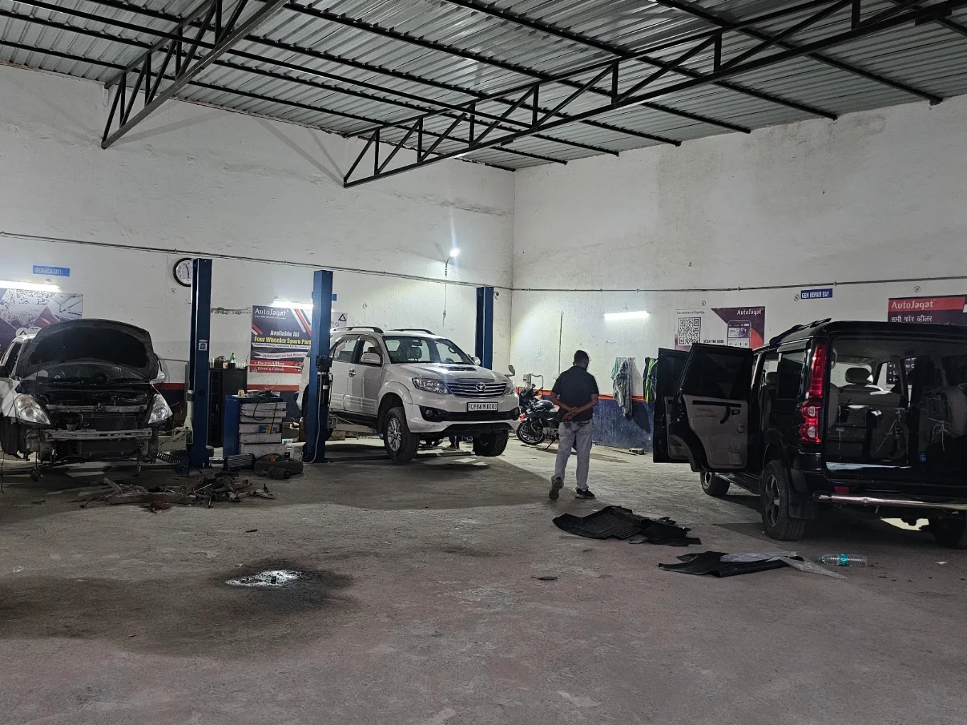 Cars being serviced inside the CARKHANA workshop